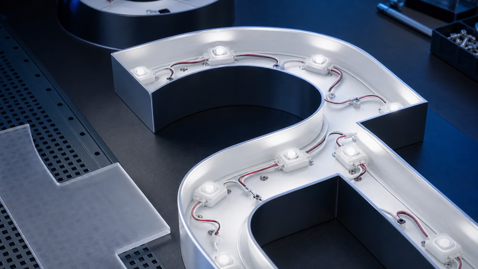 LED modules installed inside an open channel letter sign housing